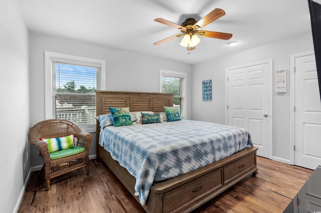 bedroom featuring hardwood / wood-style floors and ceiling fan