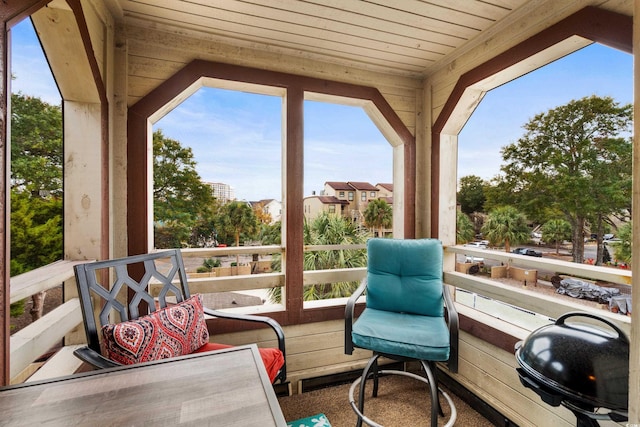 sunroom / solarium with vaulted ceiling