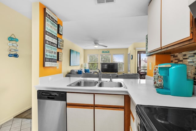 kitchen featuring decorative backsplash, stainless steel dishwasher, ceiling fan, sink, and white cabinets