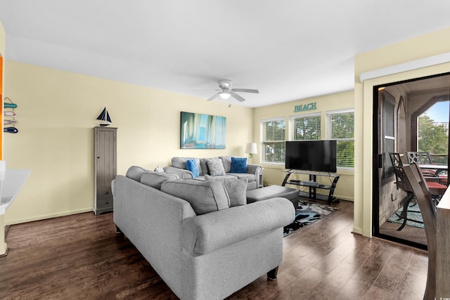 living room featuring dark hardwood / wood-style floors and ceiling fan