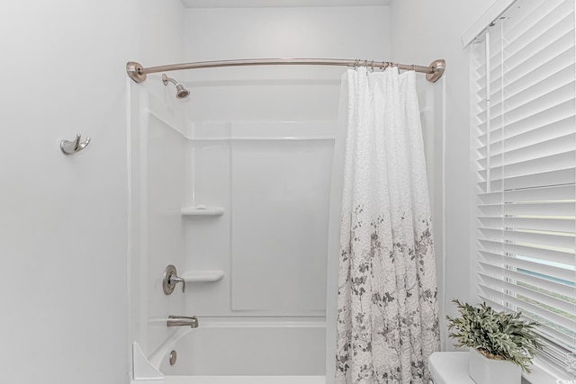 full bath featuring shower / bathtub combination with curtain