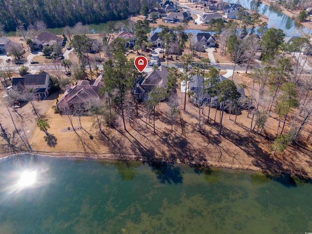 aerial view featuring a residential view and a water view