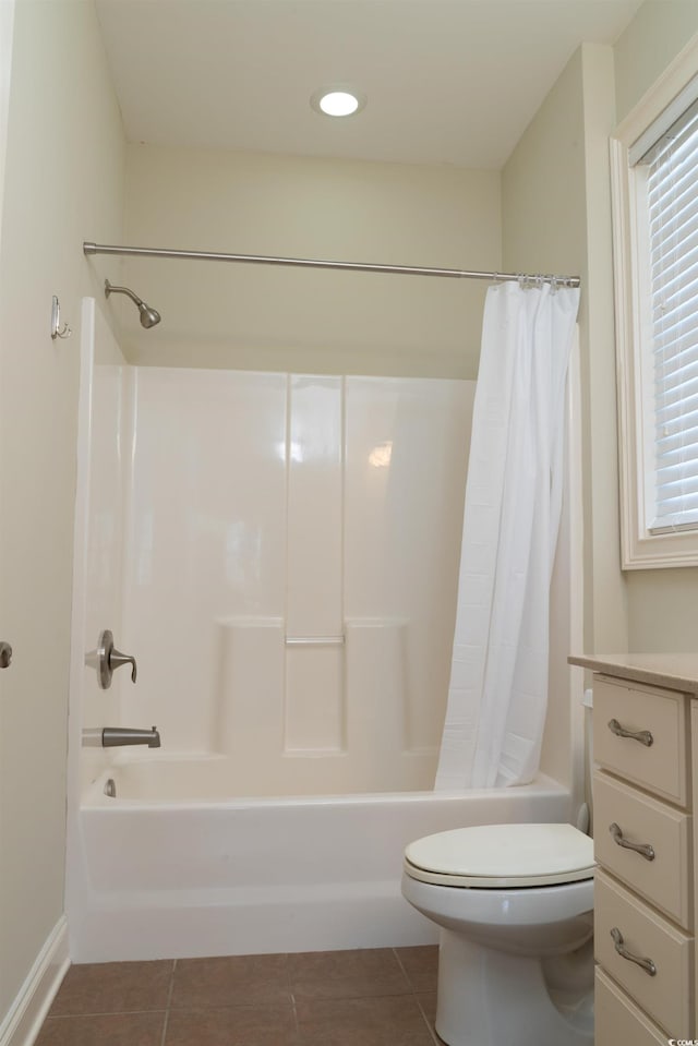 full bathroom featuring toilet, tile patterned flooring, and shower / bath combination with curtain