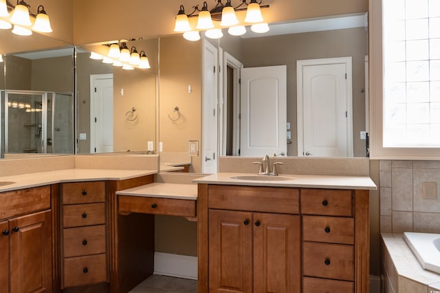 bathroom featuring tile patterned flooring, a garden tub, vanity, and a shower stall