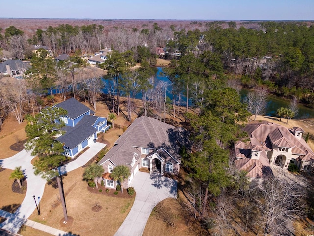 birds eye view of property with a water view and a residential view