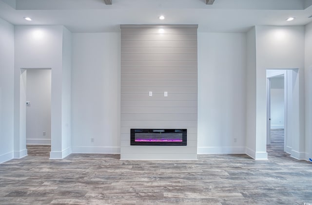 unfurnished living room with light hardwood / wood-style floors and a fireplace