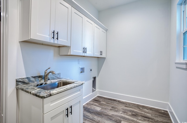 clothes washing area featuring cabinets, dark hardwood / wood-style flooring, sink, washer hookup, and hookup for an electric dryer