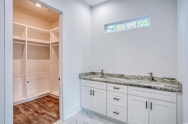 bathroom featuring vanity and hardwood / wood-style flooring