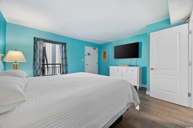 bedroom featuring dark hardwood / wood-style flooring