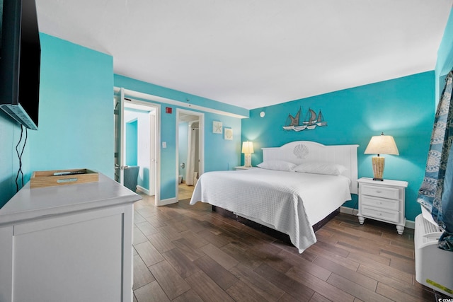 bedroom featuring dark wood-type flooring