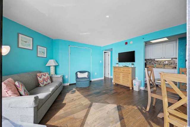 living room featuring dark wood-type flooring