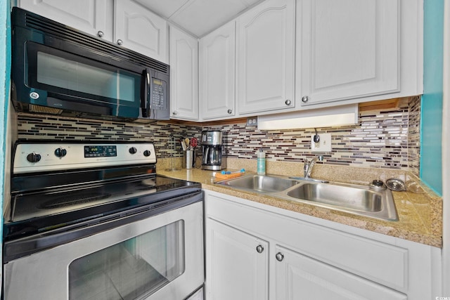 kitchen with stainless steel range with electric stovetop, decorative backsplash, white cabinets, and sink