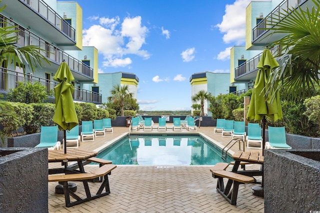 view of swimming pool with a patio area