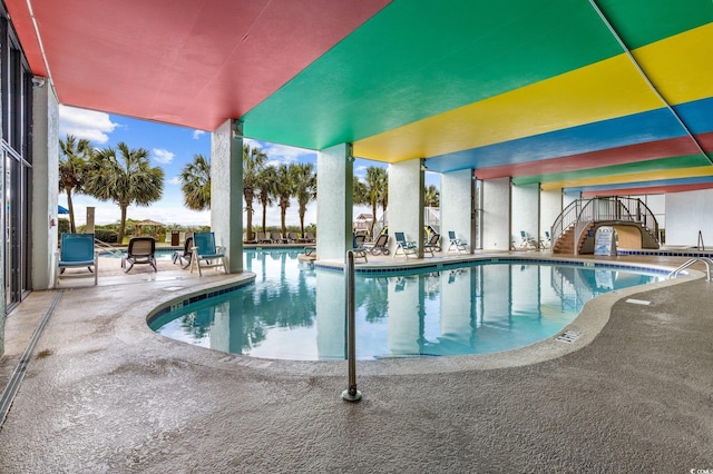 view of swimming pool featuring a patio