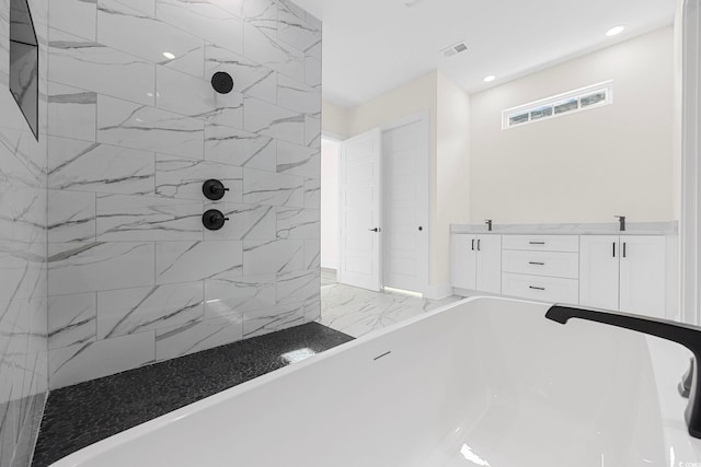 bathroom with recessed lighting, visible vents, a freestanding bath, marble finish floor, and a tile shower