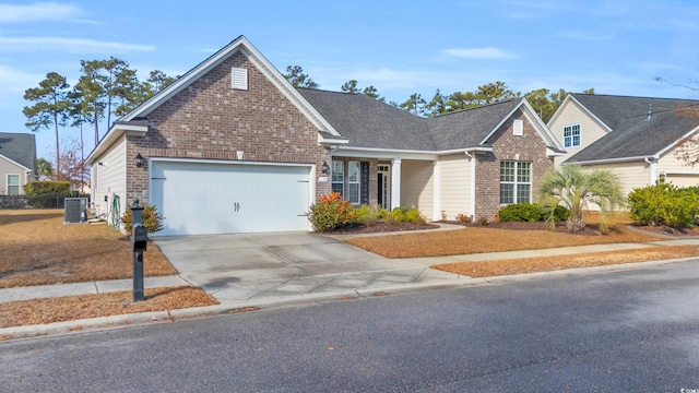 view of front of property featuring central AC unit and a garage