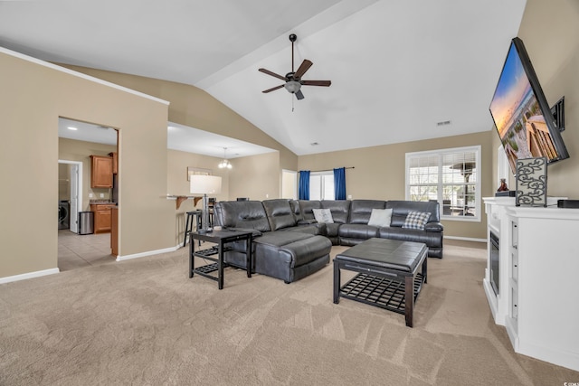 living room with light carpet, ceiling fan with notable chandelier, and vaulted ceiling