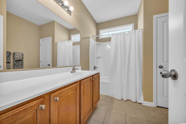 bathroom with vanity, tile patterned floors, and shower / bath combo with shower curtain