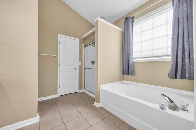 bathroom featuring plus walk in shower, tile patterned floors, and lofted ceiling