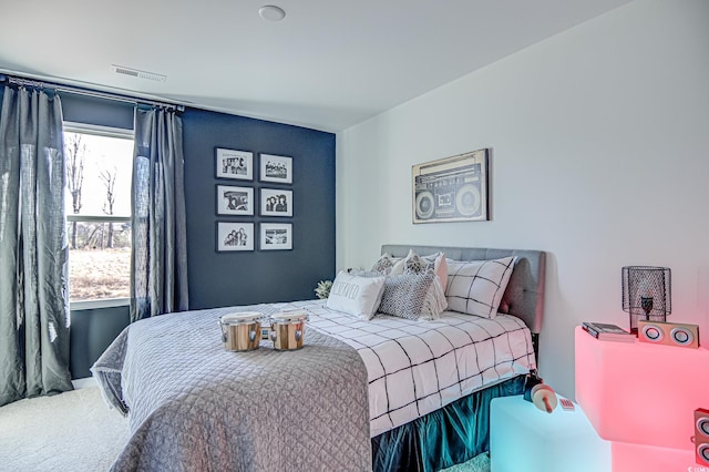 bedroom with carpet and visible vents