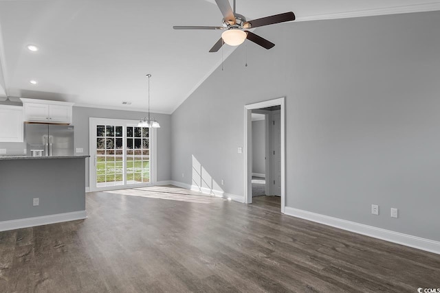 unfurnished living room with crown molding, ceiling fan with notable chandelier, high vaulted ceiling, and dark hardwood / wood-style floors