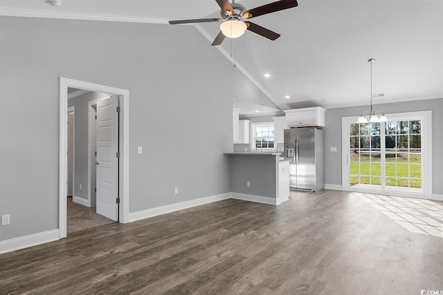 unfurnished living room with crown molding, ceiling fan with notable chandelier, dark wood-type flooring, and high vaulted ceiling