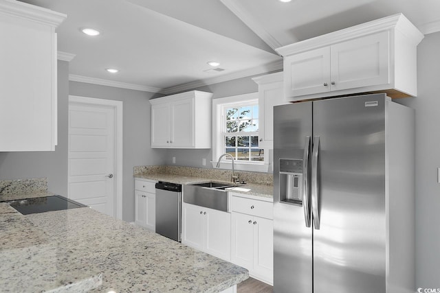 kitchen with sink, stainless steel appliances, white cabinets, and light stone countertops