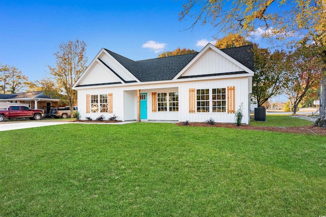 modern inspired farmhouse featuring central AC unit and a front lawn