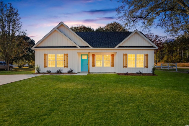 ranch-style house with a lawn