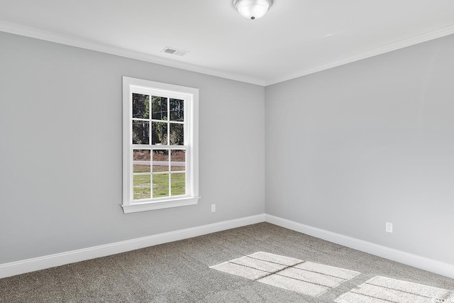 unfurnished room featuring ornamental molding and carpet flooring