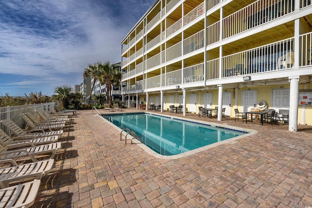 view of swimming pool featuring a patio area