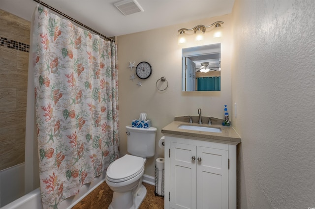 full bathroom with vanity, shower / bath combo, and toilet