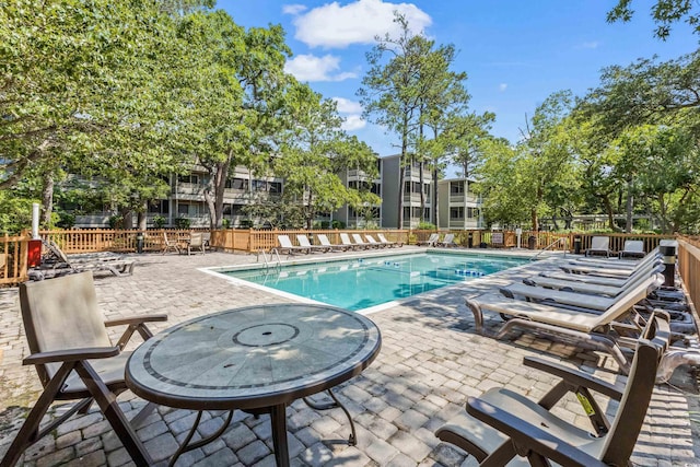 view of swimming pool featuring a patio area