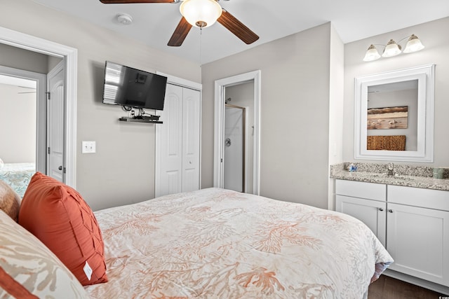 bedroom with ceiling fan and sink