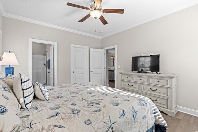 bedroom with ceiling fan, light wood-type flooring, crown molding, and connected bathroom