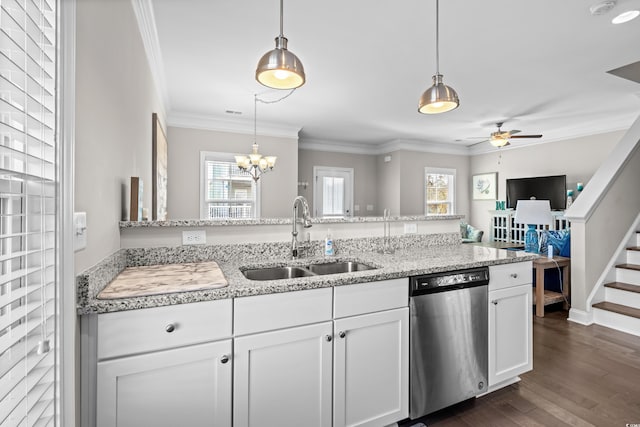 kitchen featuring dishwasher, pendant lighting, ceiling fan with notable chandelier, white cabinets, and sink