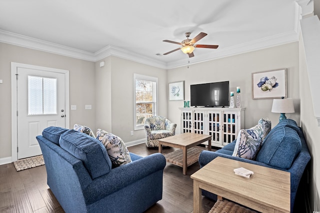 living room with dark wood-type flooring, ornamental molding, and ceiling fan