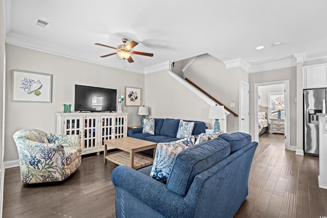 living room with ceiling fan, dark hardwood / wood-style flooring, and ornamental molding