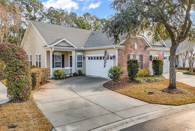 view of front of property with covered porch and a garage