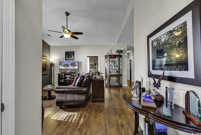 living room with hardwood / wood-style flooring and ceiling fan