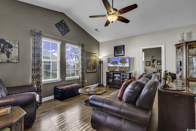 living room featuring ceiling fan, lofted ceiling, and dark wood-type flooring