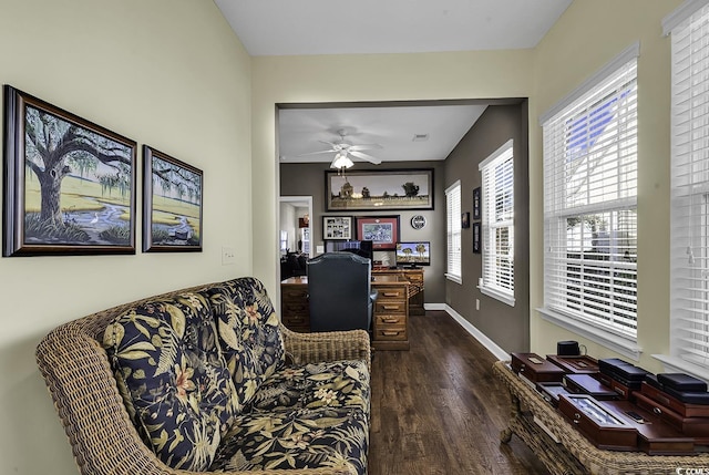 interior space with ceiling fan and dark hardwood / wood-style flooring