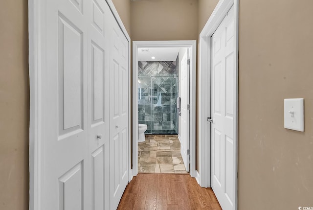 hallway with wood-type flooring