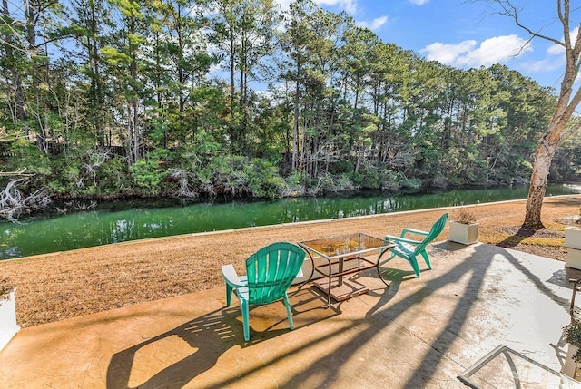 view of home's community with a patio area and a water view