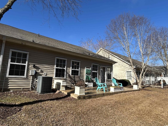 rear view of property featuring a patio and central AC unit