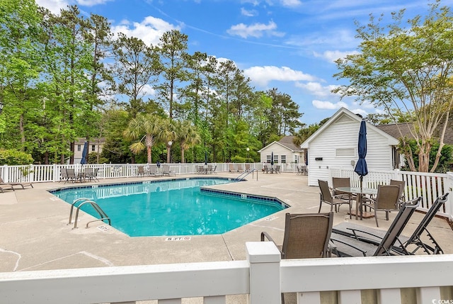 view of swimming pool featuring a patio