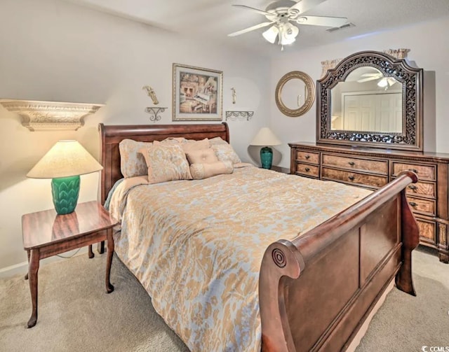 bedroom featuring light colored carpet and ceiling fan