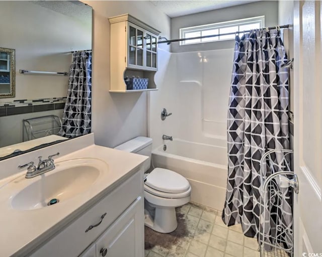 full bathroom featuring vanity, shower / tub combo, and toilet