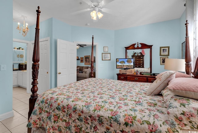 712 Algonquin Dr Unit A, Pawleys Island, SC 29585 - bedroom featuring light tile patterned floors, a chandelier, a ceiling fan, and connected bathroom