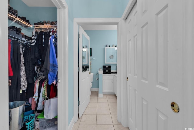 walk in closet featuring light tile patterned floors